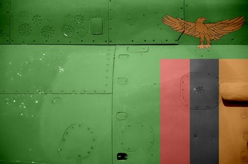 Zambia flag depicted on side part of military armored helicopter closeup. Army forces aircraft conceptual background