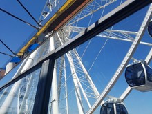 Ferris Wheel On Background Of Blue Sky
