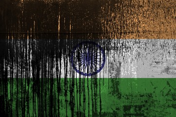 Wall Mural - India flag depicted in paint colors on old and dirty oil barrel wall closeup. Textured banner on rough background