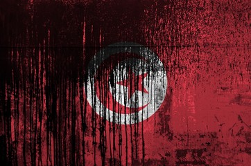 Wall Mural - Tunisia flag depicted in paint colors on old and dirty oil barrel wall closeup. Textured banner on rough background