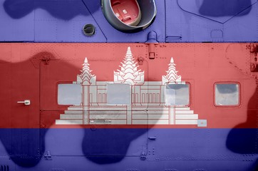 Cambodia flag depicted on side part of military armored helicopter closeup. Army forces aircraft conceptual background