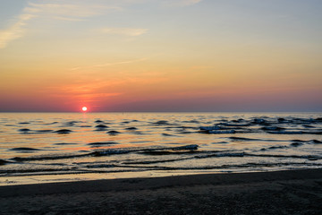 Wall Mural - Beautiful sunset on the sea. Baltic sea at sunset, Narva-Joesuu, Estonia. Narva-Joesuu - seaside resort and popular holiday destination in Estonia