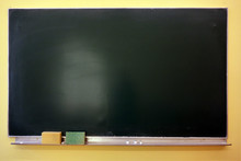 Blank Blackboard With Chalk And Sponges With Copy Space