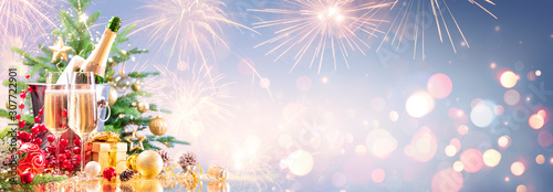 Fotomural New Year Celebration With Champagne And Fireworks - Golden Lights On Blue Backgr