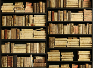 Wall Mural - old books on wooden shelf.