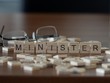 minister the word or concept represented by wooden letter tiles