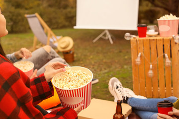 Sticker - Friends watching movie in outdoor cinema