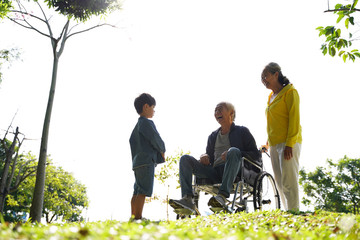 Poster - asian grandparents and grandson enjoying nature in park