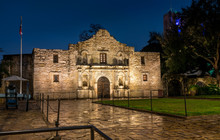 View Of The Alamo Mission In San Antonio At Night With Canon On The Side