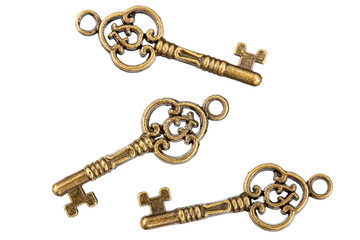 Wall Mural - Set of bronze keys, decorative element for design, isolated on white background