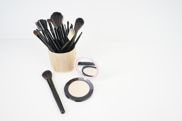 Wall Mural - Make up brushes in rotten box over white background