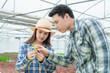 © Jirakul - The indoor temperature control organic salad farm demonstrates the variety of vegetables to the business partner