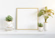 © sdecoret - Frame leaning on white shelve in bright interior with plants and decorations mockup 3D rendering