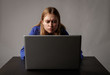 © Marijus - Young woman in blue with laptop.