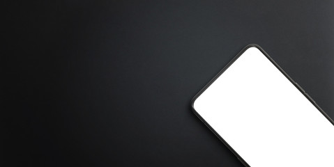 Aufkleber - Modern mobile phone close-up on black surface. Isolated screen for mockup, app presentation. Copy space beside for promo text