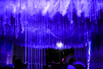 indian wedding ceremony :stage decoration with lighting and flower 