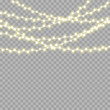 © NAUM - Christmas bright, beautiful lights, design elements. Glowing lights for design of Xmas greeting cards. Garlands, light Christmas decorations.