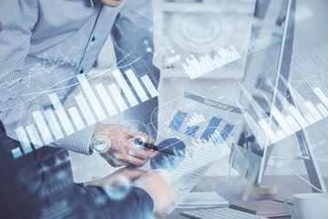 Aufkleber - Double exposure of chart with businessman typing on computer in office on background. Concept of hard work.