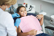 © Yakobchuk Olena - Cheerful nice girl visiting her female dentist