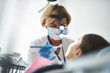 © Yakobchuk Olena - Adult dentist is doing checking-up for patient