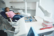 © Yakobchuk Olena - Cheerful young lady is visiting dentist and smiling
