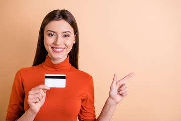 Wall Mural - photo of charming cheerful nice cute girlfriend showing you something very profitable when paying in