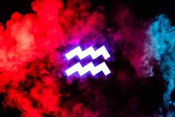 blue illuminated aquarius zodiac sign with colorful red smoke on background