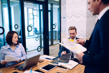 Young businesspeople having meeting in office