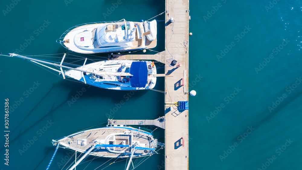 Top view of luxury yachts in the harbor, aerial shoot with drone