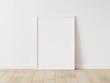 © Washdog - Vertical white frame mock up. Wooden frame poster on wooden floor with white wall. 3D illustrations.