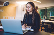 © BullRun - Millennial female reading knowledge news during web webinar on education website for progressive students connected to 4g wireless for browsing internet via modern laptop computer, technology using