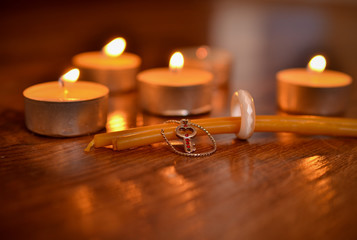 Wall Mural - Lighted candles and paraphernalia for the magic rite. Ring made of natural stone. 