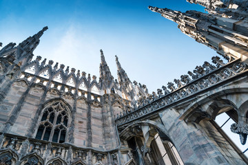 Spires and statues on the roof of Duomo Milan Cathedral, Italy.