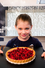 Canvas Print - beautiful girl with a big raspberry pie in her hands