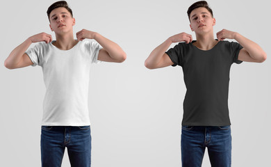 Wall Mural - Mockup white and black t-shirt on a young man in the studio.