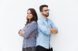 Happy friendly couple standing back-to-back, looking at camera, smiling. Young woman in casual and man in glasses in glasses posing isolated over white background. Relationship and support concept