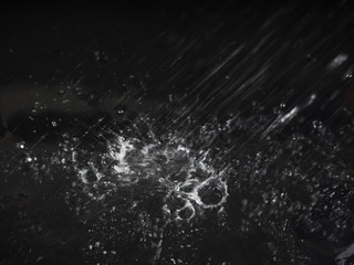 Wall Mural - Abstract splashes of water on a black background