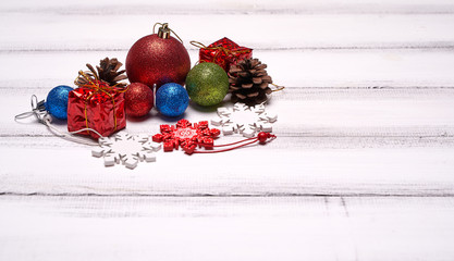 New Year or Christmas toys on white wooden background