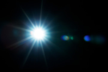 Easy to add lens flare effects for overlay designs or screen blending mode to make high-quality images. Abstract sun burst, digital flare, iridescent glare over black background.