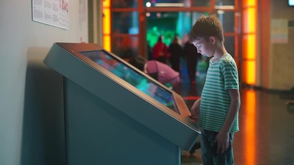 Poster - A schoolboy is standing in front of a large touch screen. Distance school. Online School. Home education during quarantine of coronavirus infection COVID-19.
