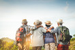 © SUPERMAO - A group of Asian seniors hiking and standing on high mountains enjoying nature. Senior community concepts