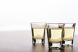 © Thodsaphol Tamklang - Vodka in a shot glass on a brown wooden background prepared for a party