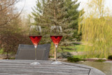Fototapeta Krajobraz - Two glasses of rose wine on a patio table