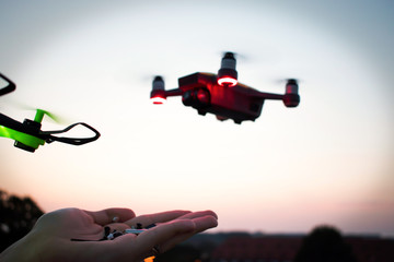 A man is going to feed the drone. The future has come. Drones bait