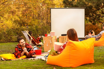 Sticker - Friends watching movie in outdoor cinema