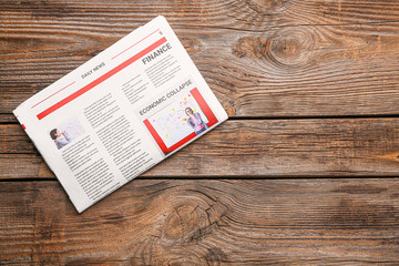 Morning newspaper on wooden background