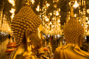 Uthai Thani, Thailand - November, 30, 2019 : Golden Buddha statue in cathedral glass at the Wat Tha Sung Temple near Uthai Thani in Thailand.Uthai Thani is small town in central Thailand