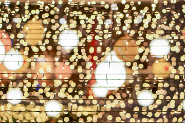 Wall Mural - Closeup and crop led light bubs of Christmas night party on blurry Christmas decorate lamps and bokeh background.