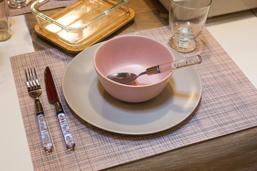 Festive decorated table setting Christmas Eve.  Beautiful  cutlery on the table. View of dining room.