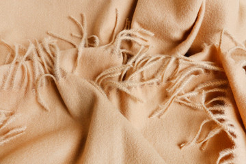 A soft beige blanket background.